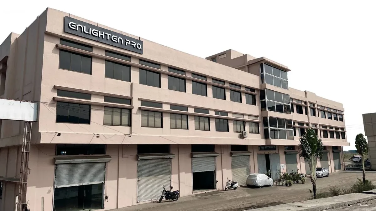 The Enlighten Pro manufacturing facility in Mumbai — a 37,000 sq ft building carrying the Enlighten Pro sign.