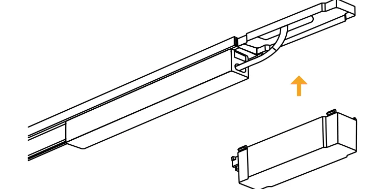An input module being pushed into the open end of the track, its lead looping up through the ceiling
