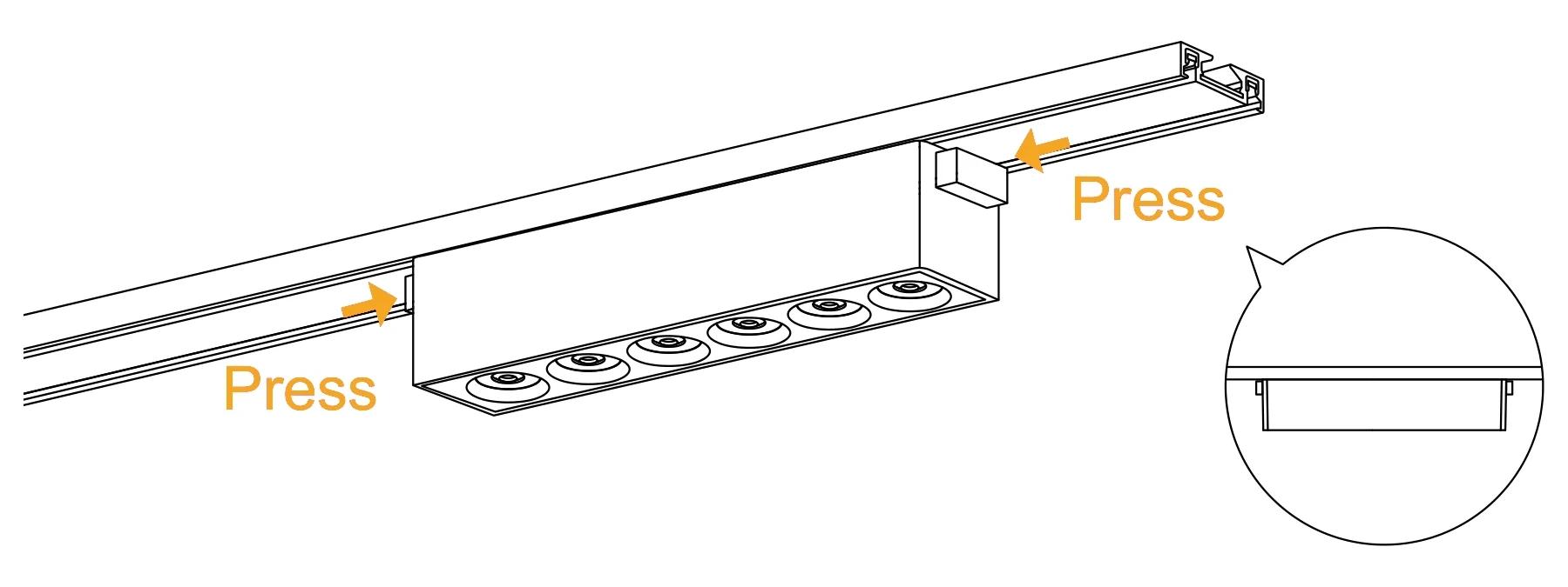 The same luminaire in the track with the catches at both ends being pressed in to lock it