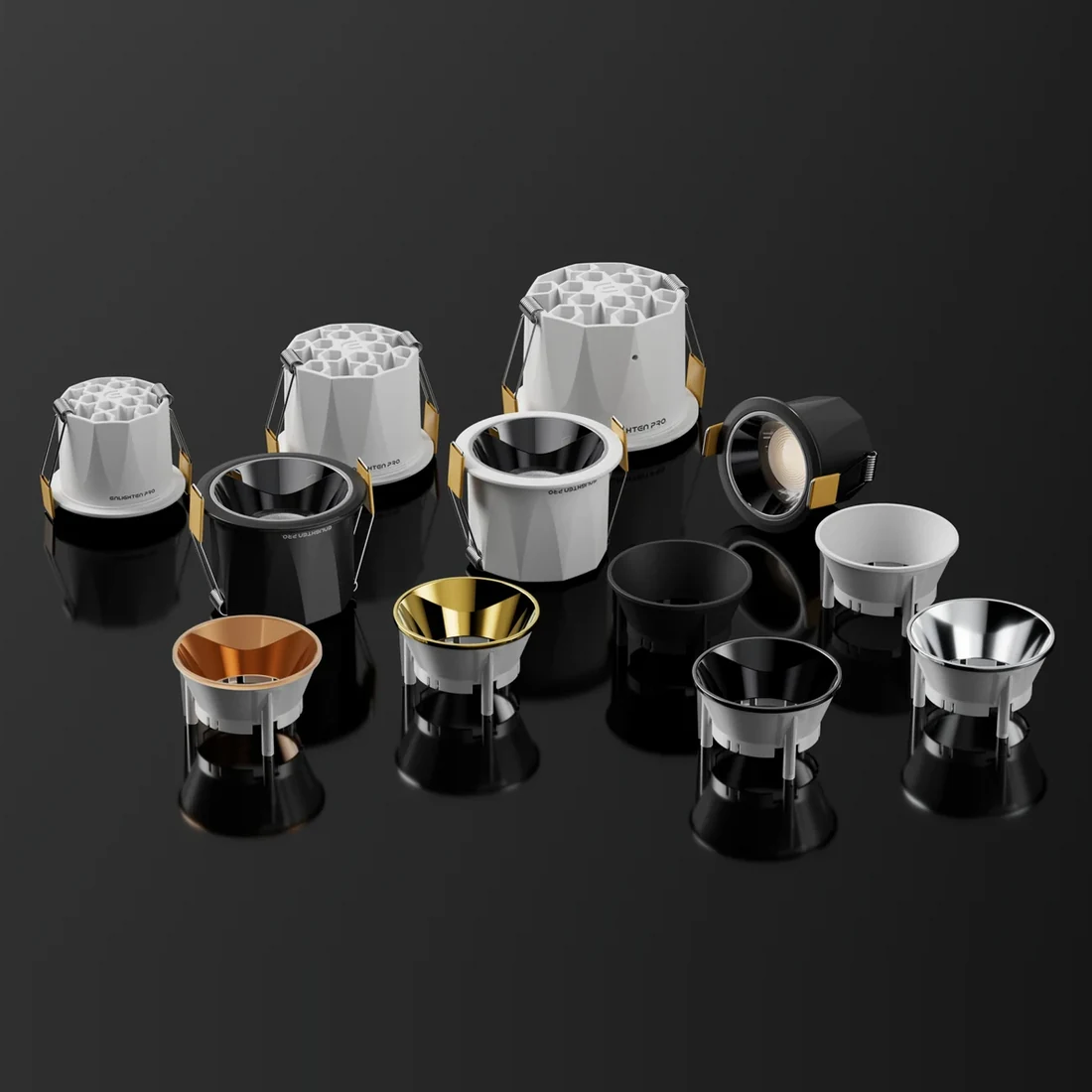 Enlighten Pro downlight bodies and reflectors — several apertures and several finishes built on one platform.